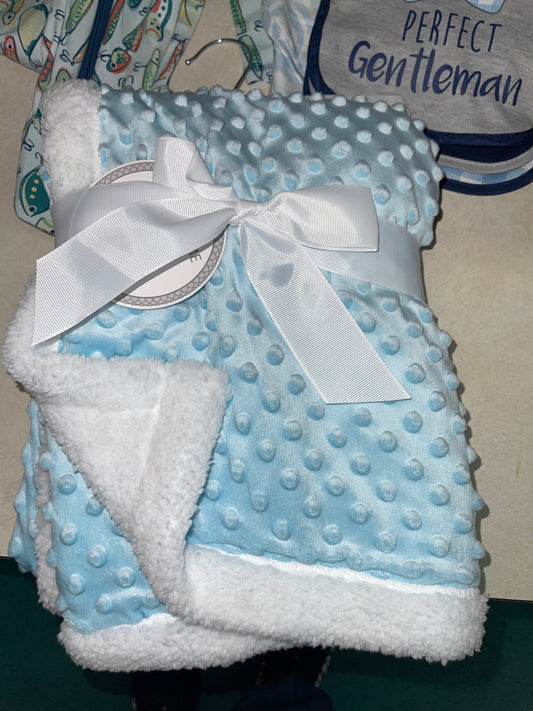 Light Blue blanket with white trim